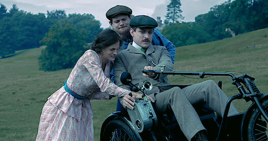 People helping out someone in a bike