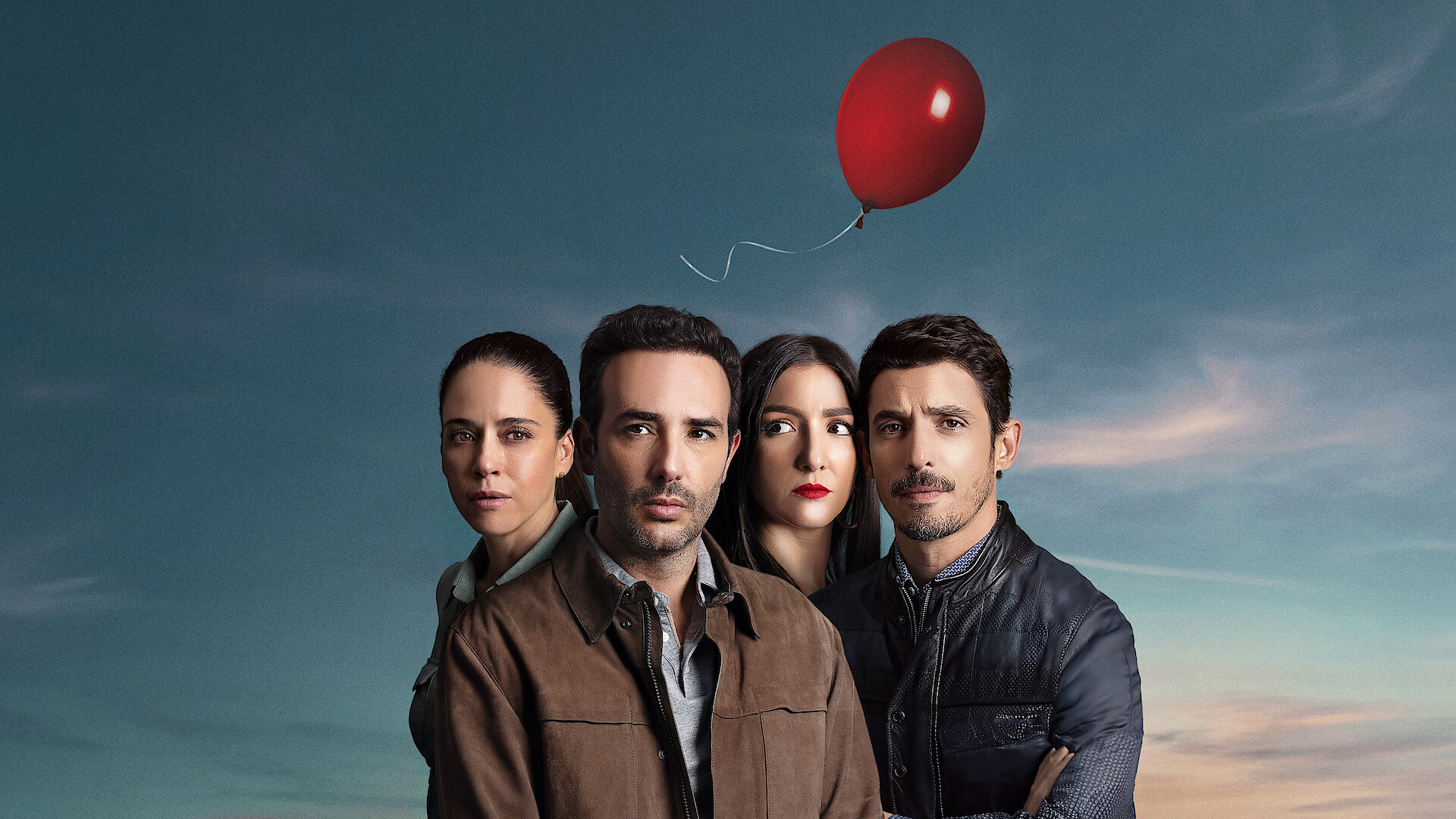 Ana Claudia Talancón, Sebastián Martínez, Eréndira Ibarra, and Alberto Guerra stand together looking stern in front of a blue sky as a red balloon floats above their heads. 