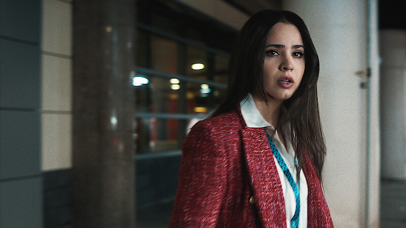 Sofia Carson in red blazer looking distressed.