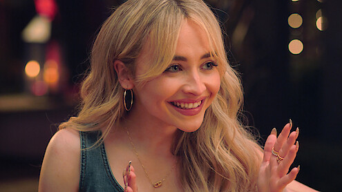 Harper (Sabrina Carpenter) laughs in 'Tall Girl.' 