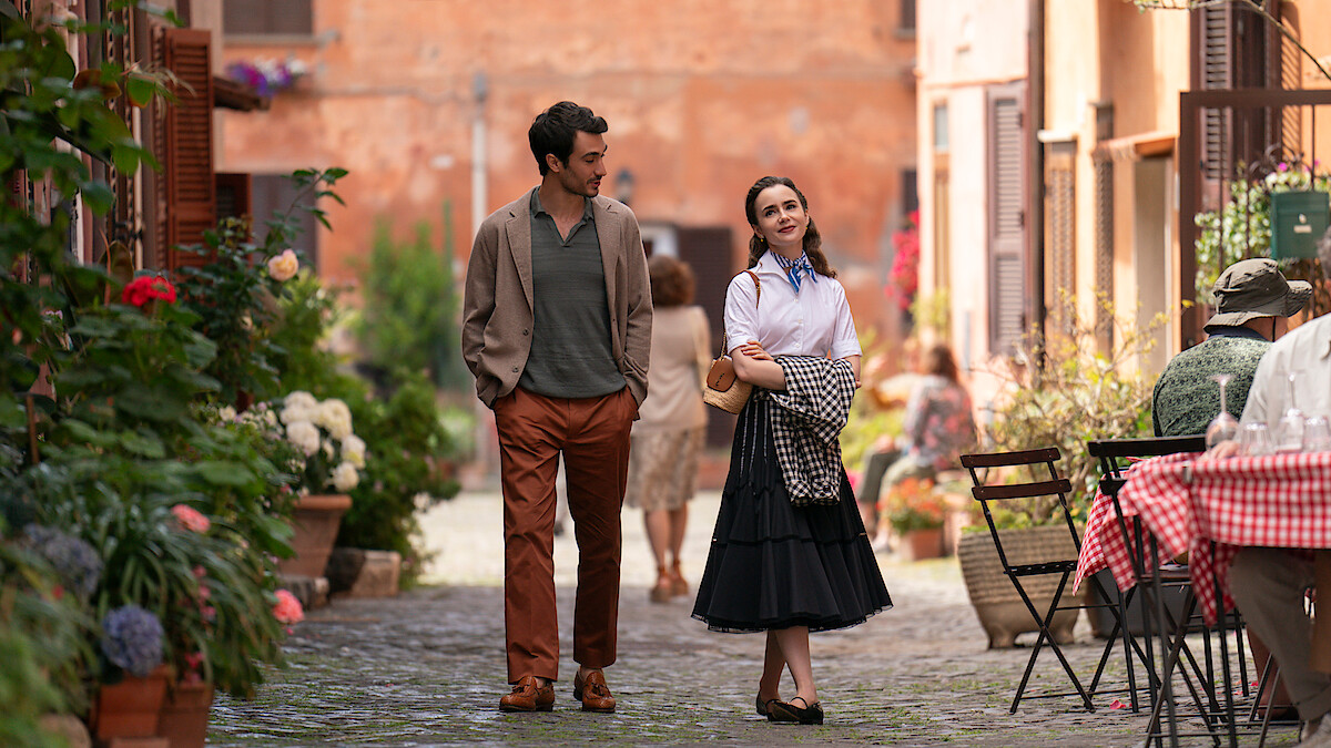 Eugenio Franceschini as Marcello and Lily Collins as Emily walk together in Rome 'Emily in Paris'