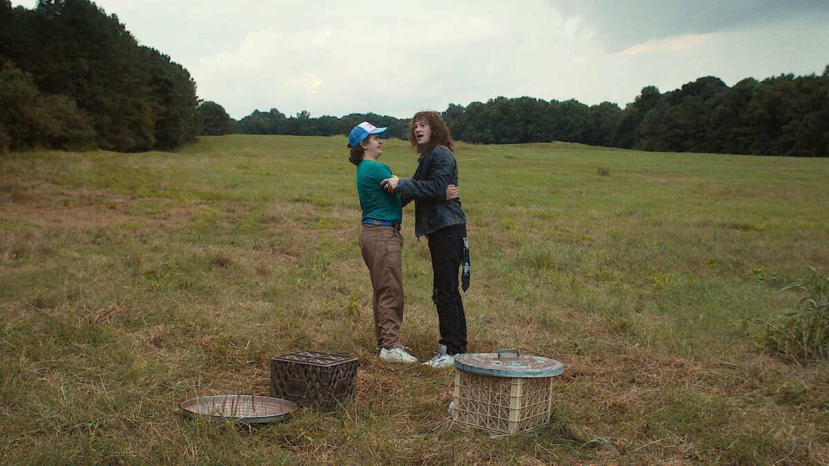 Eddie and Dustin holding each other in 'Stranger Things' Season 4.