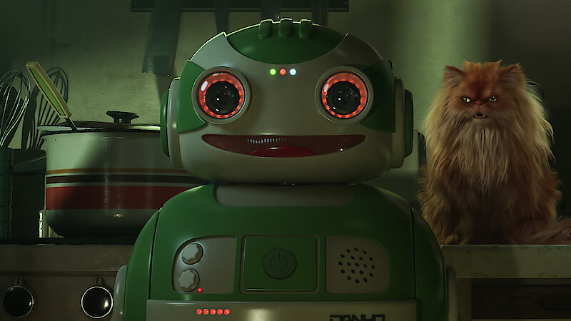 A cheerful green robot with glowing red eyes stands in a kitchen, while a grumpy-looking, fluffy orange cat sits on the counter next to cereal boxes labeled "CRUNCHY BALLS."