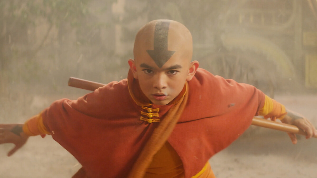 Gordon Cormier as Aang wears an orange cloak in season 1 of 'Avatar: The Last Airbender'