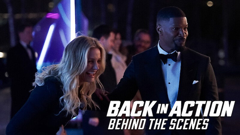 Cameron Diaz laughing next to Jamie Foxx on the set of 'Back in Action'.