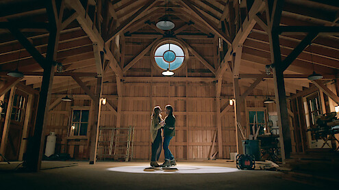Alexandra Breckenridge as Mel and Martin Henderson as Jack dance in a barn together in Season 6 of 'Virgin River'