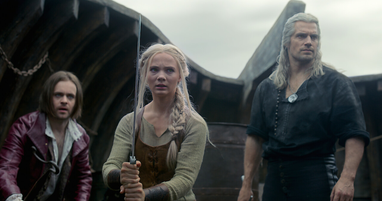 Jaskier, Ciri, and Geralt prepare for a fight in The Witcher.