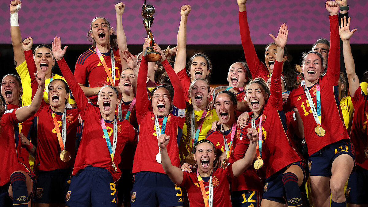 Spain teammates celebrate with the FIFA Women's World Cup Trophy