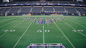 The Dallas Cowboys Cheerleaders on the field.