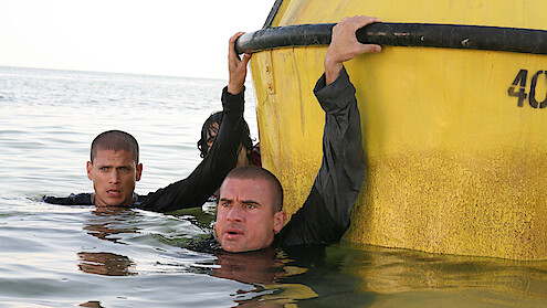 Wentworth Miller as Michael Scofield and Dominic Purcell as Lincoln 'Linc' Burrows hang on to a buoy.