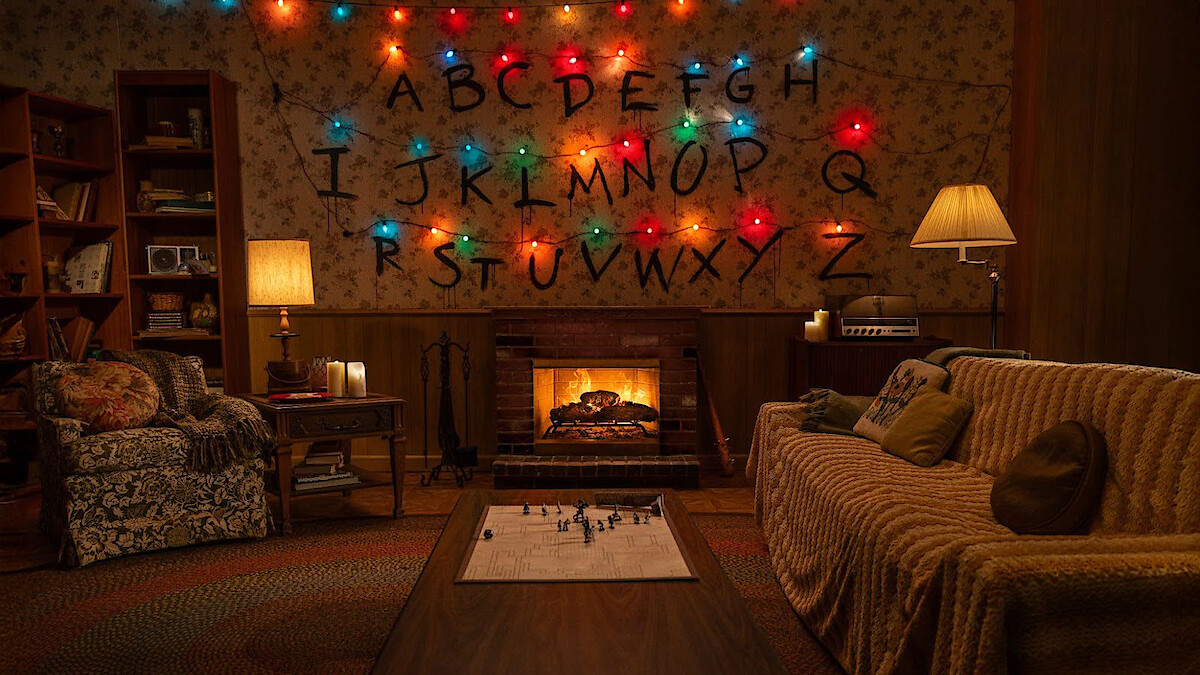 'Stranger Things' fireplace in a living room with an alphabet wall