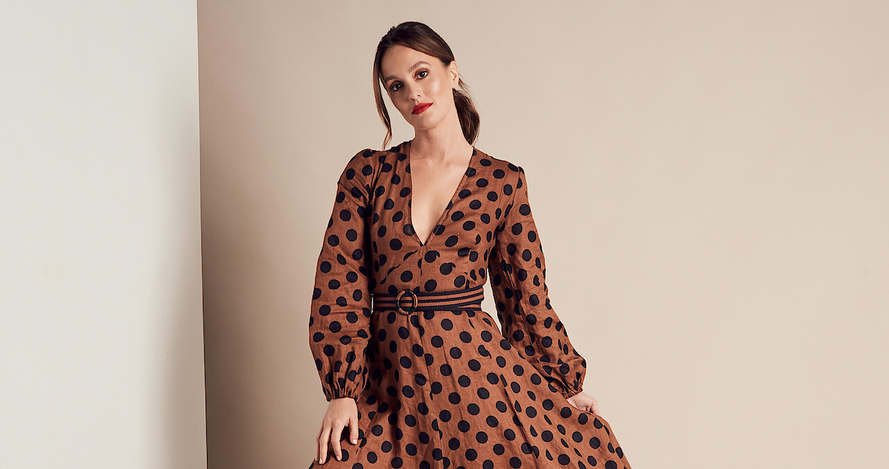 A glamor shot of Leighton Meester in a brown dress with black polkadots