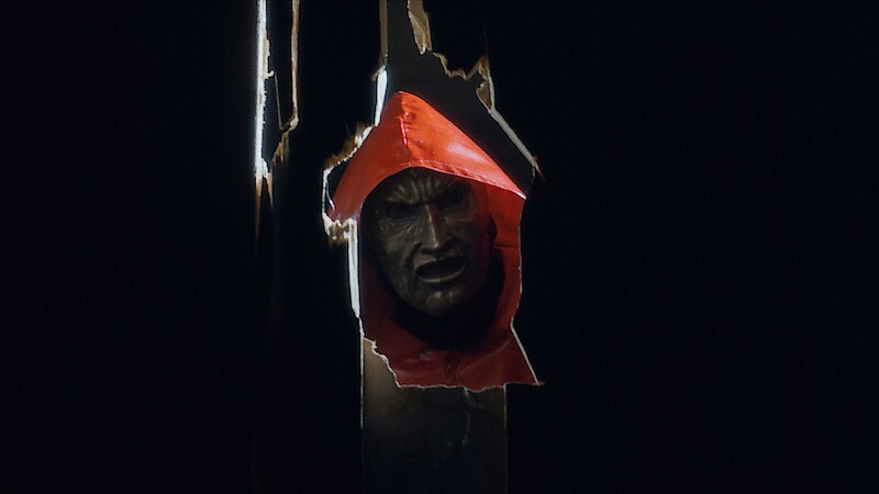The Killer looks through the opening in 'Fear Street: Prom Queen.'