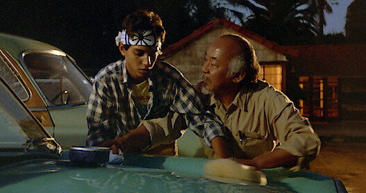 An image of young Daniel LaRusso with Mr. Miyagi