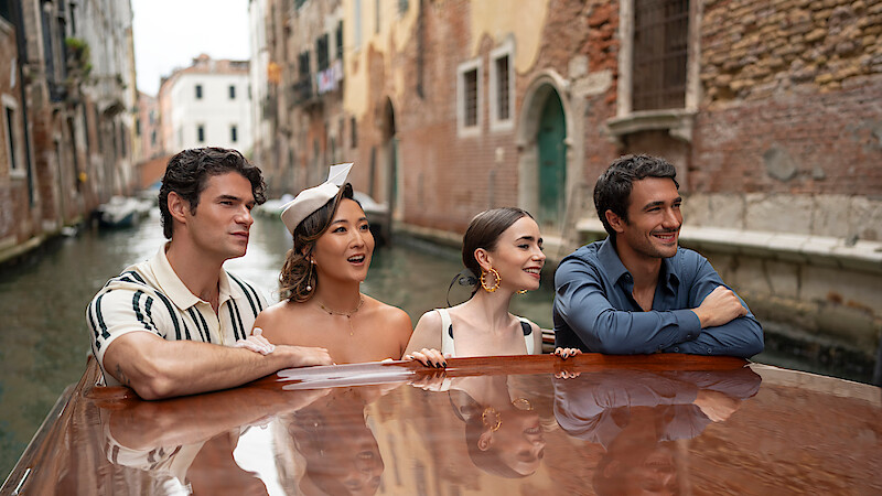 Paul Forman as Nicolas De Leon, Ashley Park as Mindy, Lily Collins as Emily and Eugenio Franceschini as Marcello in 'Emily in Paris' Season 5.