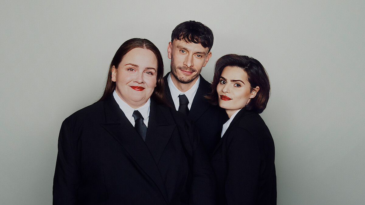 Jessica Gunning, Richard Gadd, and Nava Mau wear suits and pose against a light gray background.